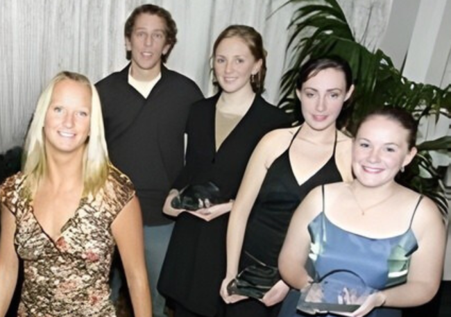 Five-times world surfing champion Layne Beachley pictured with some of the winners from the 2003 Youth Achievement Awards.